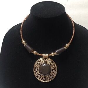 Gold Tone and Brown Ornate Pendant Necklace